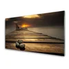 tulup.si Slika na steklu Morje pier sunset 100x50 cm 2 obešalnika