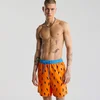 Cropp - Kupaći šorc s printom preko cele površine The Flintstones - orange