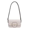 Torbica Guess Janie - krem