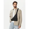 Torbica za okrog pasu Calvin Klein Utility Emblem Aop Crossbody LV04D3386G Črna