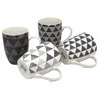 PORCELANSKA SKODELICA Z GEOMETRIČNIMI VZORCI - MEŠANICA VZORCEV