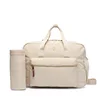 Torba za otroški voziček Tommy Hilfiger KA0KA00026 Kremna
