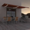 vidaXL Avtomatska tenda LED + senzor 600x300 cm oranžno/rjava