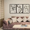 Wallity Metalna zidna dekoracija sa dezenom lica 109x50 cm crna