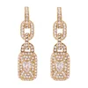 GUESS Uhani CRYSTAL LOVE zlata / transparentna