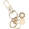 Guess EVERLEE KEYCHAIN RWR746 01030 Pozlačena