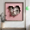 WallXpert uramljena MDF slika DOS047-50, mače viri kroz rupu u obliku srca na roze pozadini, 50 x 50 cm