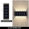 KJB Solarna stenska svetilka gor/dol, 12 LED, topla bela svetloba, 4 kosi