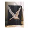WallXpert uramljena slika 115246, beli labud u letu na tamnoj pozadini, 50 x 70 cm, crni ram