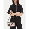 Ročna torba Tommy Jeans Tjw Must Cow Shoulder Bag AW0AW18061 Pisana