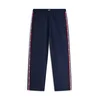 Tommy Jeans Hlače JAIMIE  mornarska / rdeča / bela