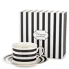 Skodelica in krožnik iz porcelana, bela, črna