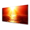 tulup.si Slika na steklu Sunset sea wave 140x70 cm 4 obešalnika