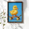 WallXpert uramljena MDF slika NAL108-70, žuto pače na skejtbordu na plavoj pozadini, 50 x 70 cm