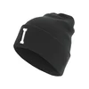Knitted hat with letter cuff I