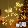 Nikcorp LED okenska dekoracija jelenček Slogovna (nabor 2 kosa, 120 LED, topla praznična svetloba, 8 načinov, časovnik 6 ur delovanja/18 ur premora, baterijsko, daljinski upravljalnik), bela