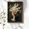 WallXpert uramljena MDF slika NAL025-70, žensko lice prekriveno belim leptirima na tamnoj pozadini, 50 x 70 cm