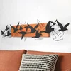 WallXpert zidni ukras od drveta i metala Liberta, jato ptica u letu, 100 x 22 cm, crveno drvo / crni