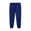Tommy Hilfiger Spodnji del trenirke Essential UM0UM03911 Mornarsko modra Relaxed Fit
