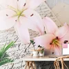 Fototapeta lilija na elegantnem listu - 245x165