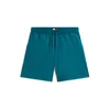 Tommy Jeans Hlače Tommy Flag Beach Sweat petrol