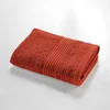 Opečnato oranžna frotirna bombažna brisača 50x90 cm Tendresse – douceur dintérieur