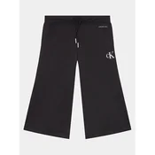 Calvin Klein Jeans Spodnji del trenirke Logo IG0IG02449 Črna Relaxed Fit