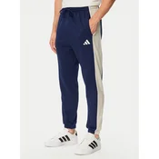 adidas Spodnji del trenirke Seasonal Essentials Colorblock Fleece KF4211 Modra Cosy Fleece Fit
