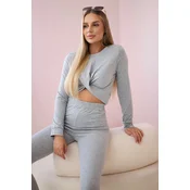 Set with ruffles on a gray blouse
