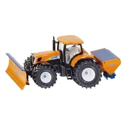 Traktor sa plugom za oranje i posipacem