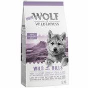12 kg suhe hrane Wolf of Wilderness + Snack gratis! - Junior Wild Hills raca - brez žit + Leafy Willows - teletina & piščanec
