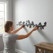 WallXpert metalni zidni ukras 5343, ptice na grani, 75 x 17 cm, crni