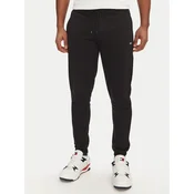 Tommy Jeans Spodnji del trenirke Flag DM0DM20473 Črna Slim Fit