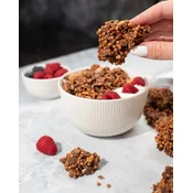 Protein Granola –? kosmiči in oreščki, zapečeni v velike hrustljave skupke, obogateni z mlečnimi beljakovinskimi hrustljavčki, preprost prigrizek ali osnova za hranljiv zajtrk