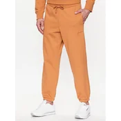 New Balance Spodnji del trenirke MP23551 Oranžna Relaxed Fit