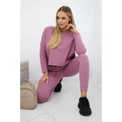 Complete with an oversized blouse in dark pink
