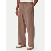 adidas Spodnji del trenirke Kit Small Logo Wide KW2339 Bež Relaxed Fit