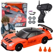 slomart LEAN TOYS Športni avto RC 1:24, oranžni, z zamenljivimi kolesi