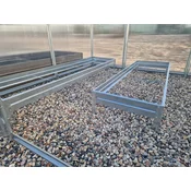 A set of raised beds for a greenhouse 3 m wide