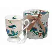 Nežna porcelanasta skodelica z motivom rože in ptice