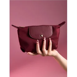 Sinsay - Kozmetička torbica sa preklopom od imitacije kože - maroon