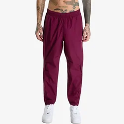 Nike Donji dio trenerke M NRG NOCTA CS TRK PANT WVN