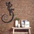 WallXpert metalni zidni ukras 5084, ornamentalni gušter sa spiralnim repom, 56 x 90 cm, crni