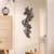 WallXpert metalni zidni ukras DCV-1001-MT, apstraktna lelujava traka od linija, 50 x 20 cm, crni