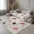 Kremno bel pralen tekač 80x200 cm Cracked Terrazzo – Mila Home
