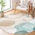 Modra/bež pralna okrogla preproga o 120 cm Puddle – Mila Home