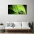 tulup.si Steklena slika Dew drops leaf 125x50 cm 4 obešalnika