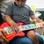 BABY EINSTEIN Igrača lesena glasbena kitara Together in Tune Guitar™ Connected Magic Touch