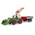 Fendt Vario 211 s čelnim nakladalnikom in prikolico s stransko steno