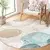 Modra/bež pralna okrogla preproga o 100 cm Puddle – Mila Home